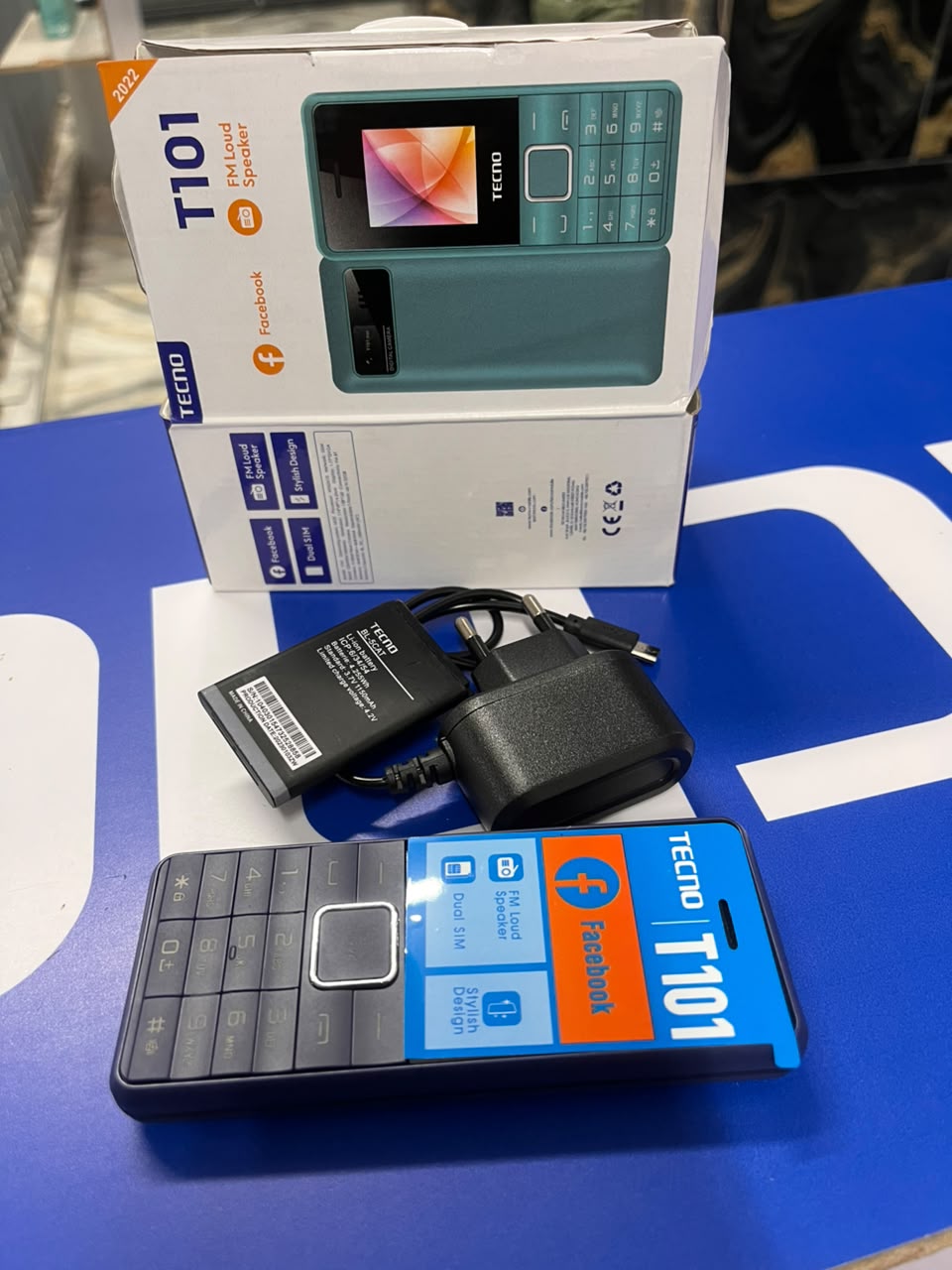 TECNO T101 FEATURE PHONE 32MB RAM 32MB ROM 1.77 INCH QVGA DISPLAY 0.08 MP REAR CAMERA 1000 MAH BATTERY DUAL SIM WIRELESS FM RADIO LOUD SPEAKER PHONES LED TORCH KATULULU KABAMBE SMARTPHONES WITH WATCH