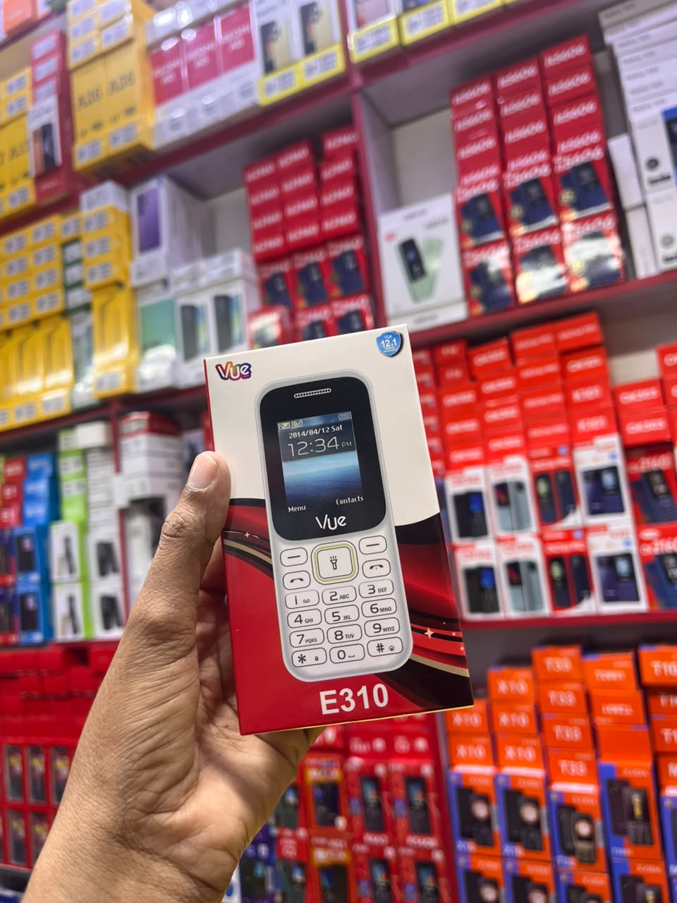 VUE E310 IS AN AFFORDABLE DUAL-SIM FEATURE PHONE FEATURING A 1.77-INCH SCREEN, A WIRELESS FM RADIO, AND A BUILT-IN TORCH LIGHT (OFTEN STYLED LOCALLY AS A "MULIKA MWIZI" OR "KABAMBE" PHONE