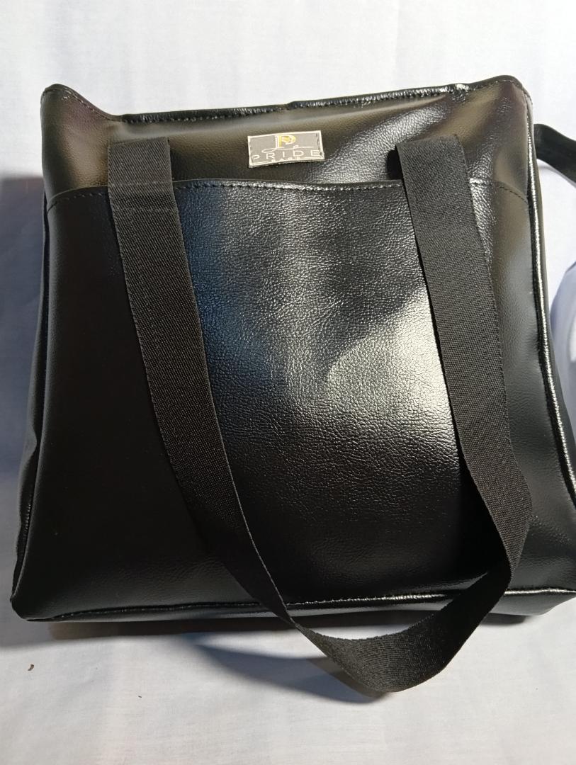 Ladies spacious waterproof totebag. can fit a laptop. strong handles with long lasting zipper and a cotton lining
