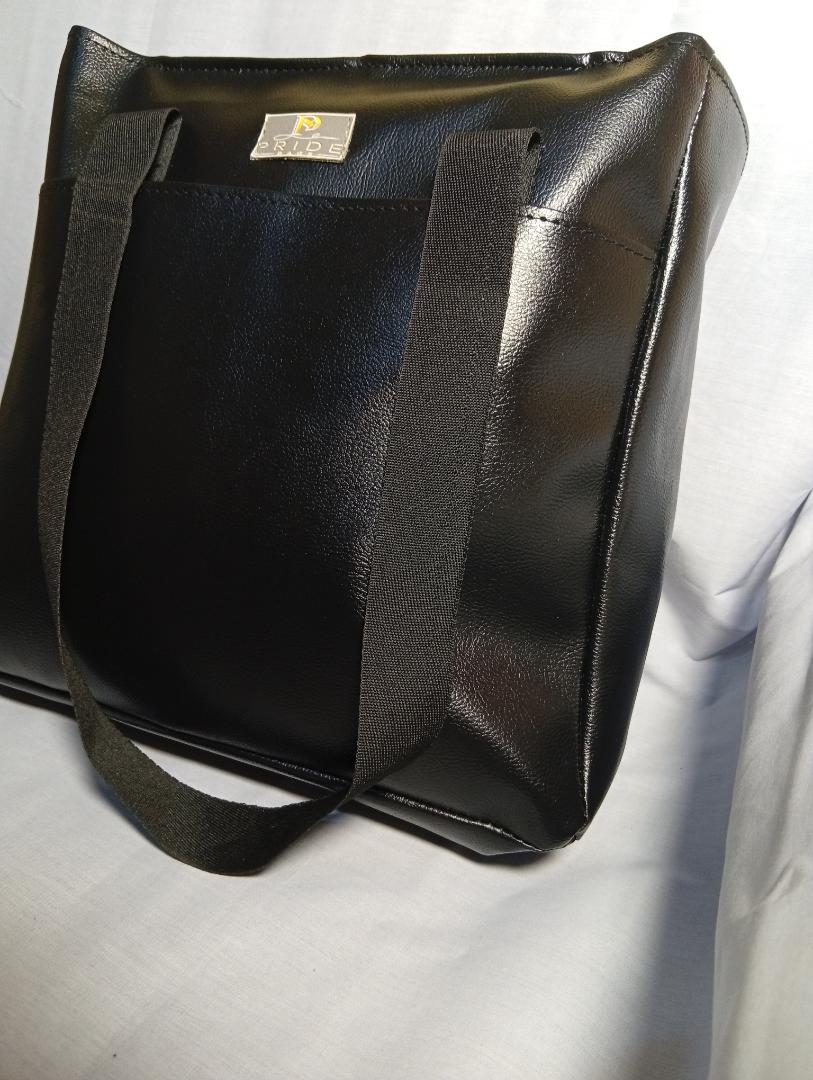 Ladies spacious waterproof totebag. can fit a laptop. strong handles with long lasting zipper and a cotton lining