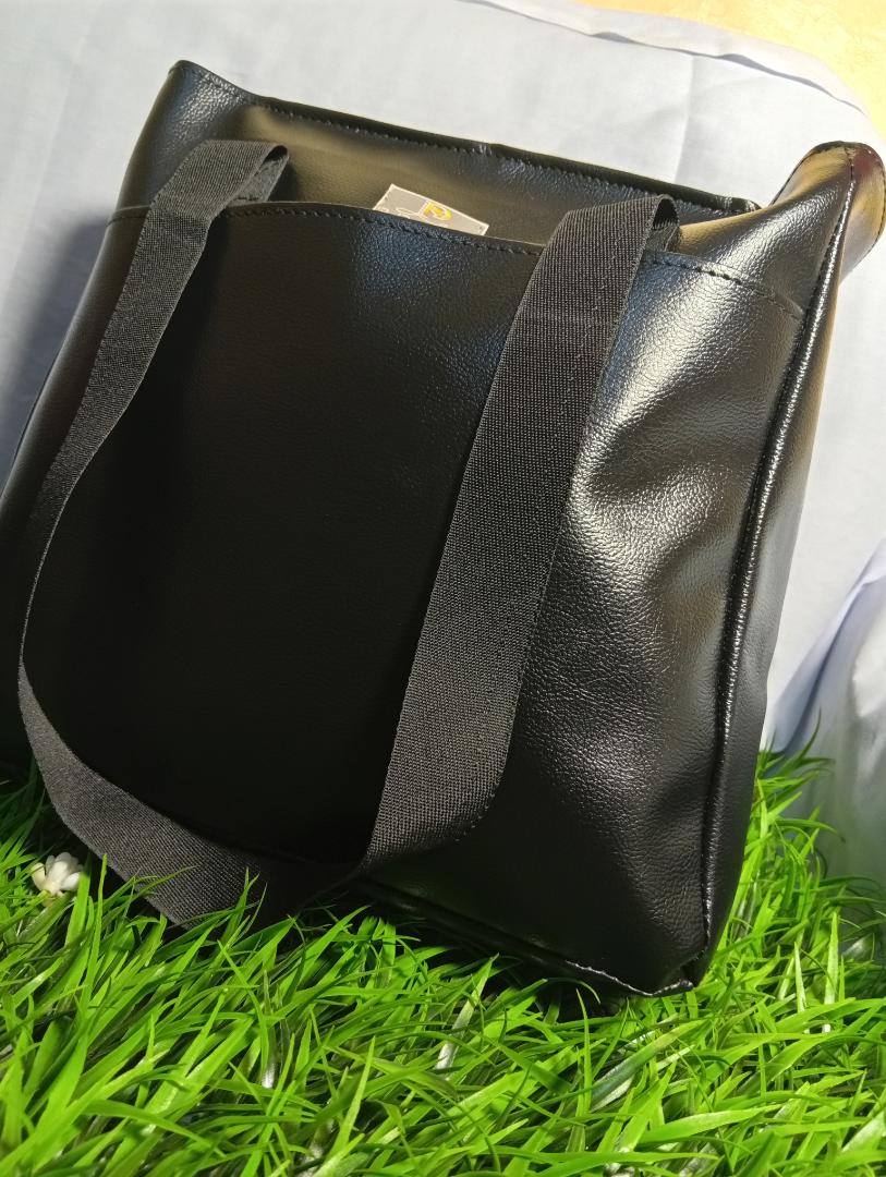 Ladies spacious waterproof totebag. can fit a laptop. strong handles with long lasting zipper and a cotton lining