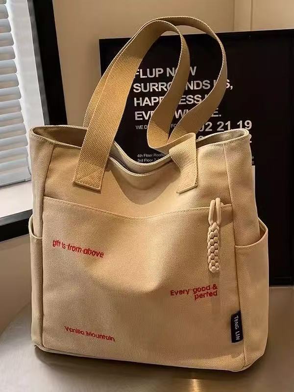 Canvas bag women's men's new trendy embroidery letter handbag student large capacity single shoulder tote bag office commuter crossbody bag