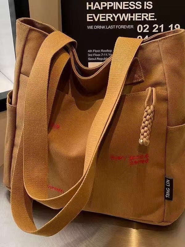 Canvas bag women's men's new trendy embroidery letter handbag student large capacity single shoulder tote bag office commuter crossbody bag