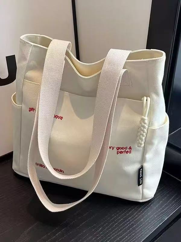 Canvas bag women's men's new trendy embroidery letter handbag student large capacity single shoulder tote bag office commuter crossbody bag