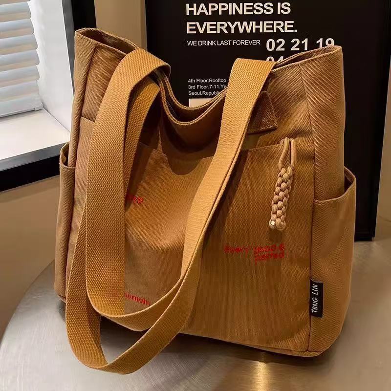 Canvas bag women's men's new trendy embroidery letter handbag student large capacity single shoulder tote bag office commuter crossbody bag