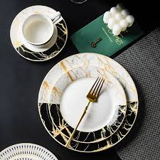 Signature Majestic Night 11" Flatter Dinner Plate features premium opalware with a striking black and white marble pattern accented by gold