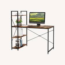 Computer desk features a rustic brown wood-grain finish paired with a black metal X-frame and an integrated multi-tier side bookshelf