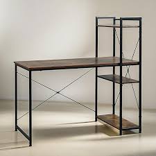 Computer desk features a rustic brown wood-grain finish paired with a black metal X-frame and an integrated multi-tier side bookshelf