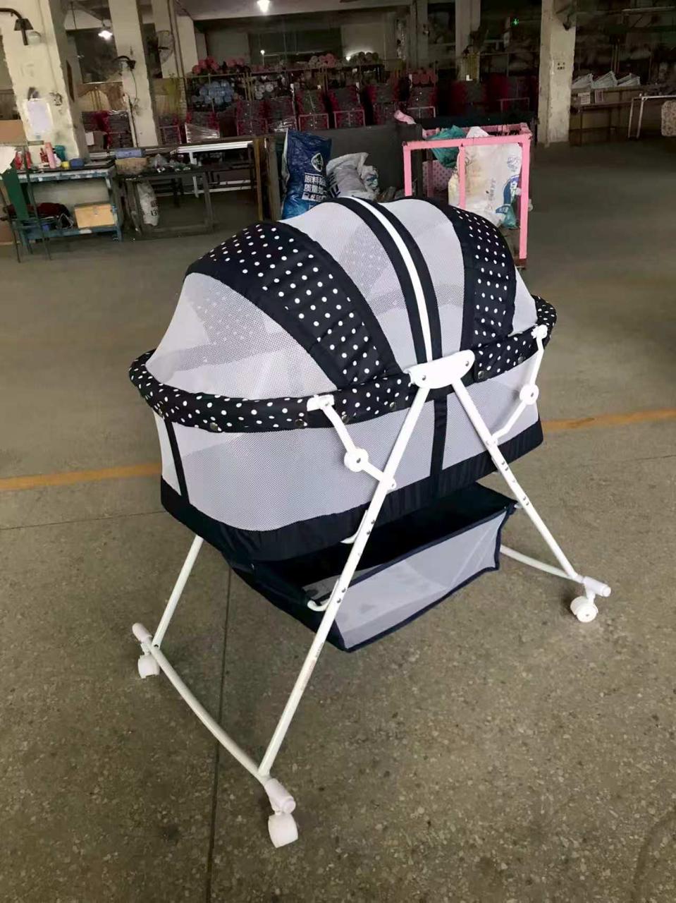 Elevated Baby Bassinet with Breathable Mesh Sides, Full Canopy, Wheeled Folding Stand and Lower Storage Basket – Black, White and Grey