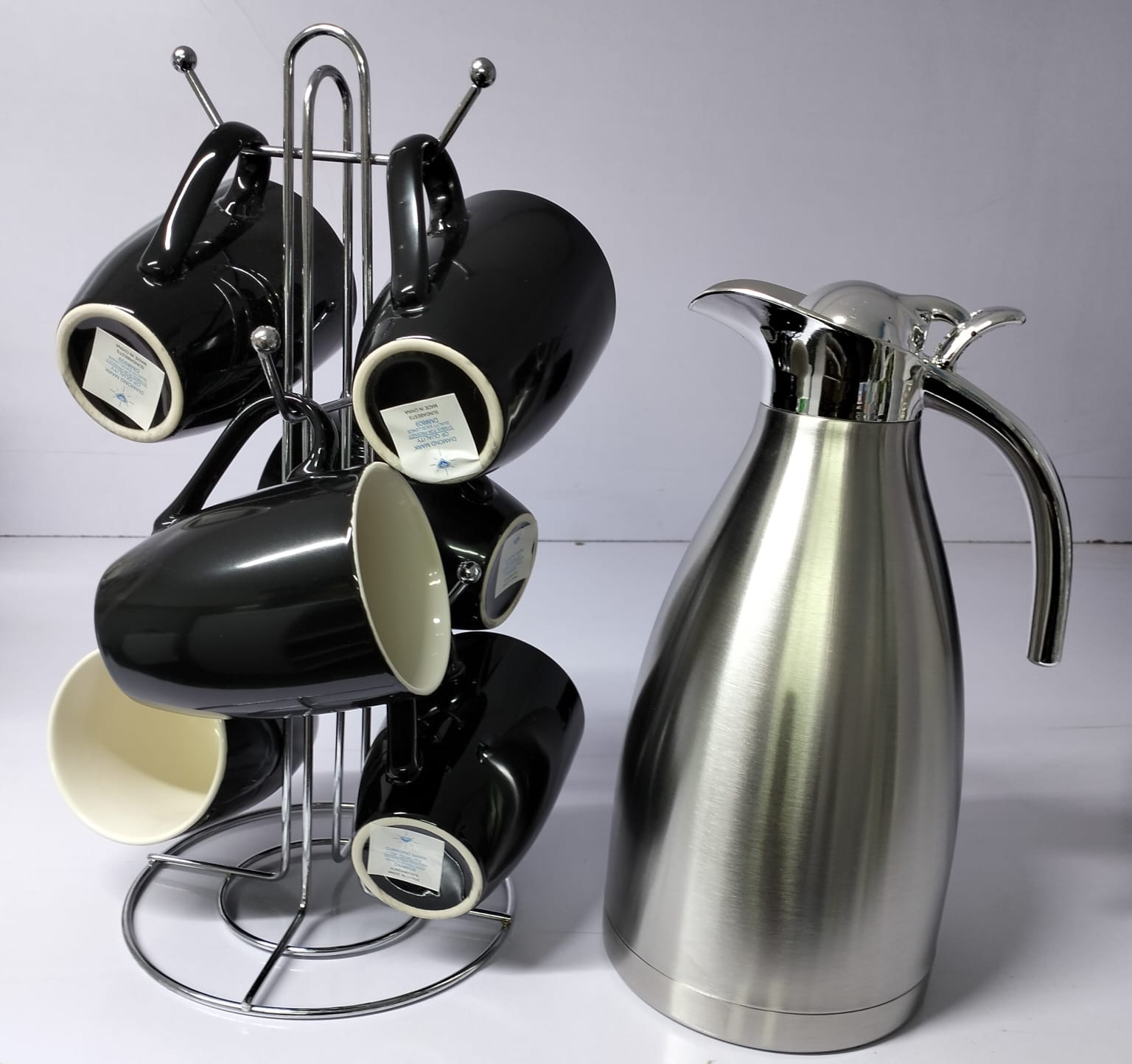 Black Flask Set available 
Contains; 
🎯6 pcs Black Mugs 
🎯1 pc Silver Flask of 2 litres capacity