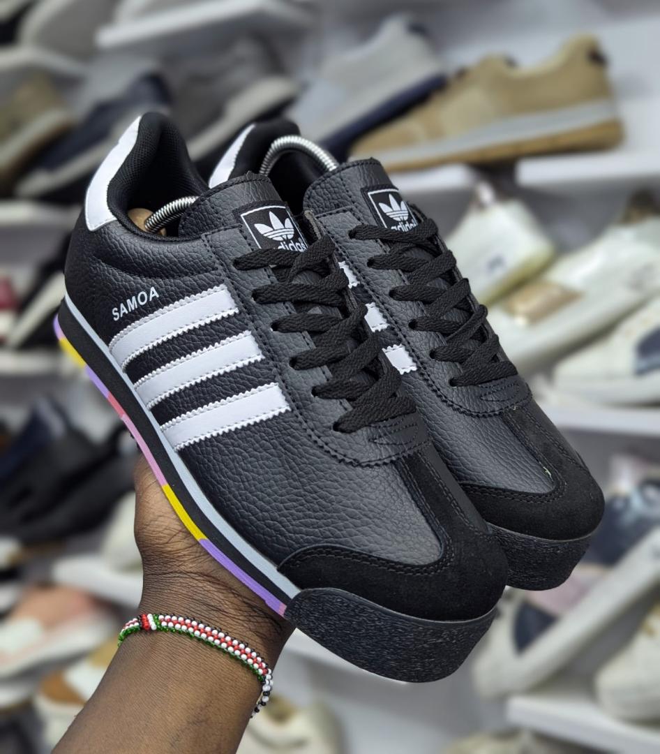 Adidas Samoa sneakers feature a smooth leather upper, signature rubber toe bumper, cushioned comfort, and classic sporty style for everyday wear.