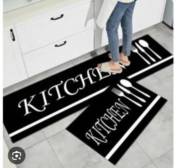 This stylish kitchen floor mat set combines functionality with modern decorative appeal. Featuring a sleek black background accented by elegant gold cookware graphics.