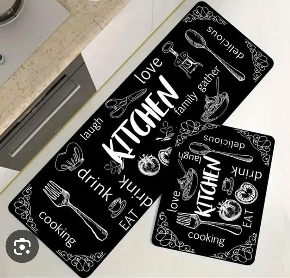 This stylish kitchen floor mat set combines functionality with modern decorative appeal. Featuring a sleek black background accented by elegant gold cookware graphics.