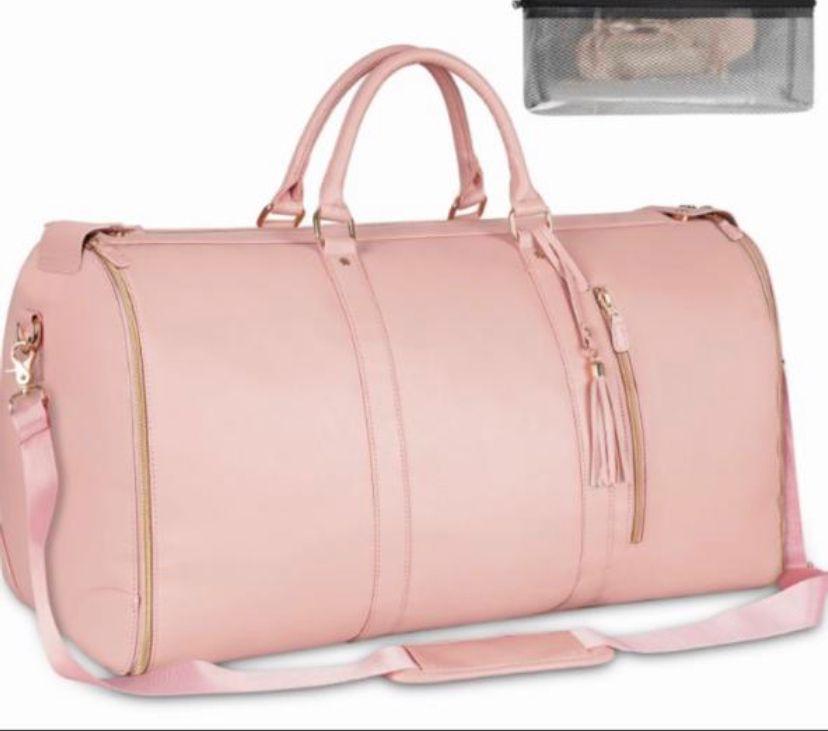 3 in 1 Ytonet garment duffle bag. A Pink foldable clean classy leather PU travel bag ingeniously combines the features of a travel garment bag with expandable compartment for maximum use of its space.