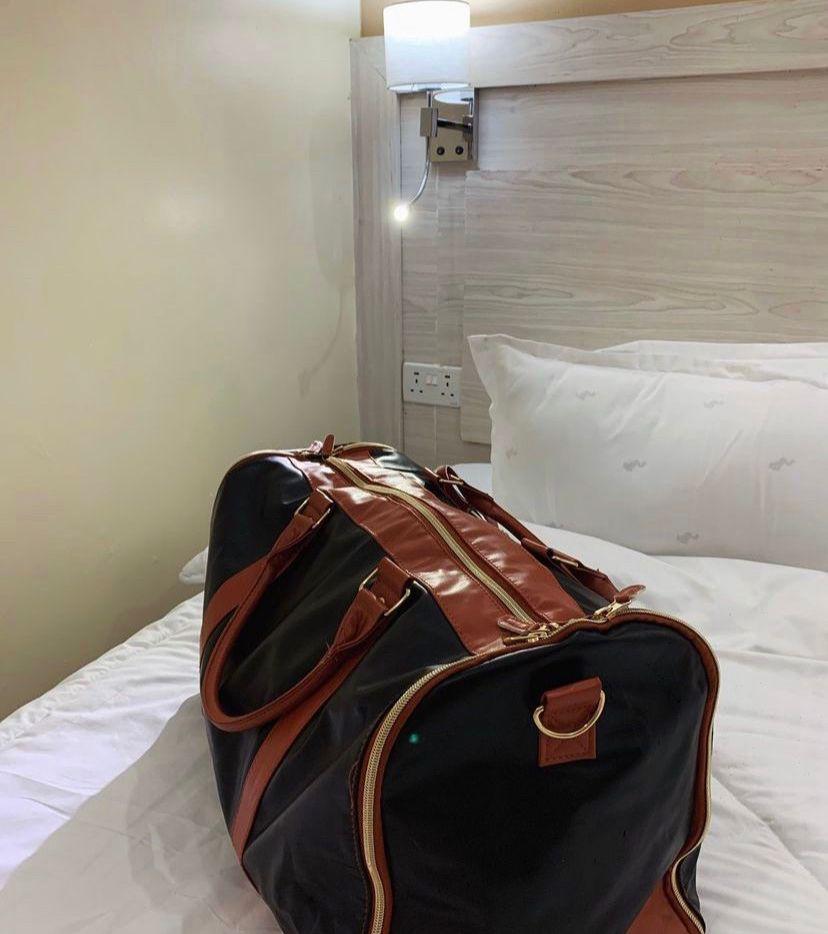 3 IN 1 Ytonet garment duffle bag. A black foldable clean classy leather PU travel bag ingeniously combines the features of a travel garment bag with expandable compartment for maximum use of its space