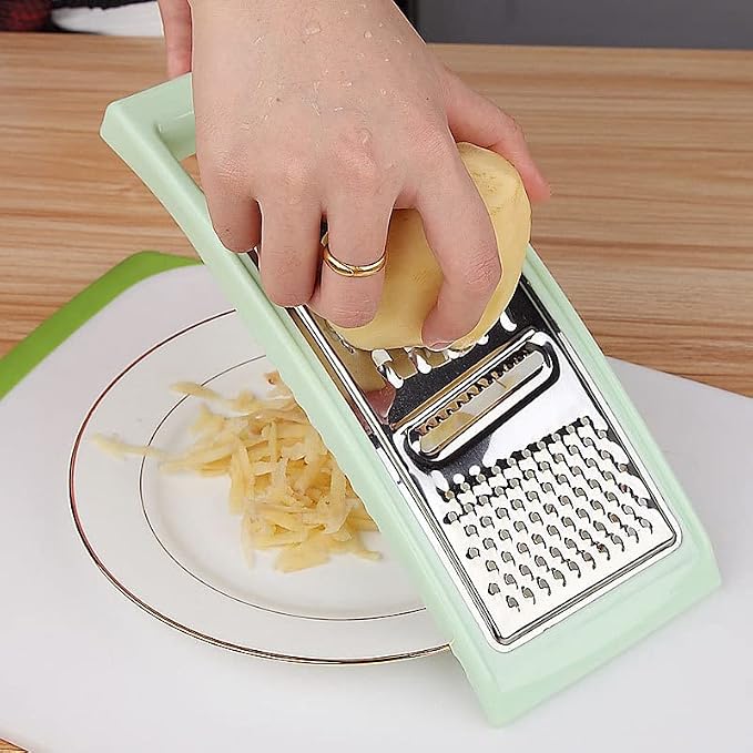 Multifunctional Stainless Steel Grater with Plastic Handle & Peeler – Vegetable, Cheese, Fruit & Kitchen Food Prep Tool