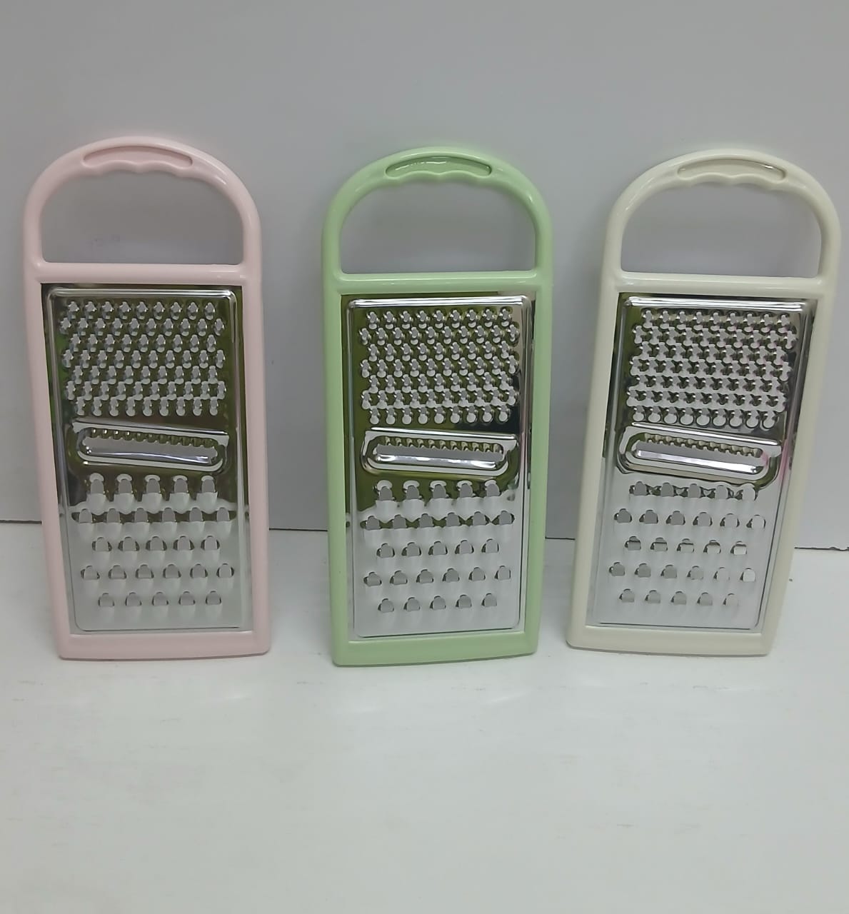 Multifunctional Stainless Steel Grater with Plastic Handle & Peeler – Vegetable, Cheese, Fruit & Kitchen Food Prep Tool