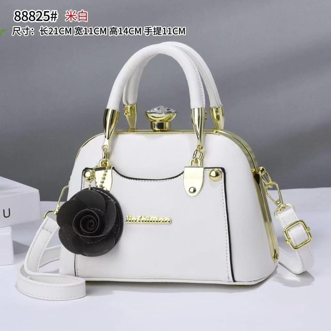 javcys stylish structured handbag featuring a classic dome-shaped silhouette with a smooth metallic finish, giving it a sophisticated and luxurious look