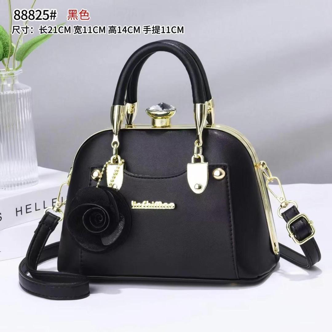 javcys stylish structured handbag featuring a classic dome-shaped silhouette with a smooth metallic finish, giving it a sophisticated and luxurious look