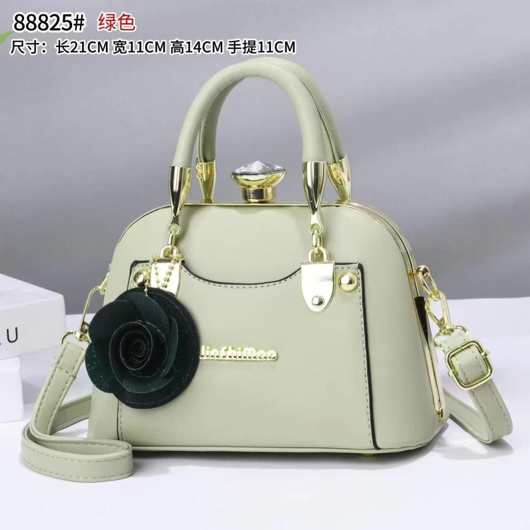 javcys stylish structured handbag featuring a classic dome-shaped silhouette with a smooth metallic finish, giving it a sophisticated and luxurious look