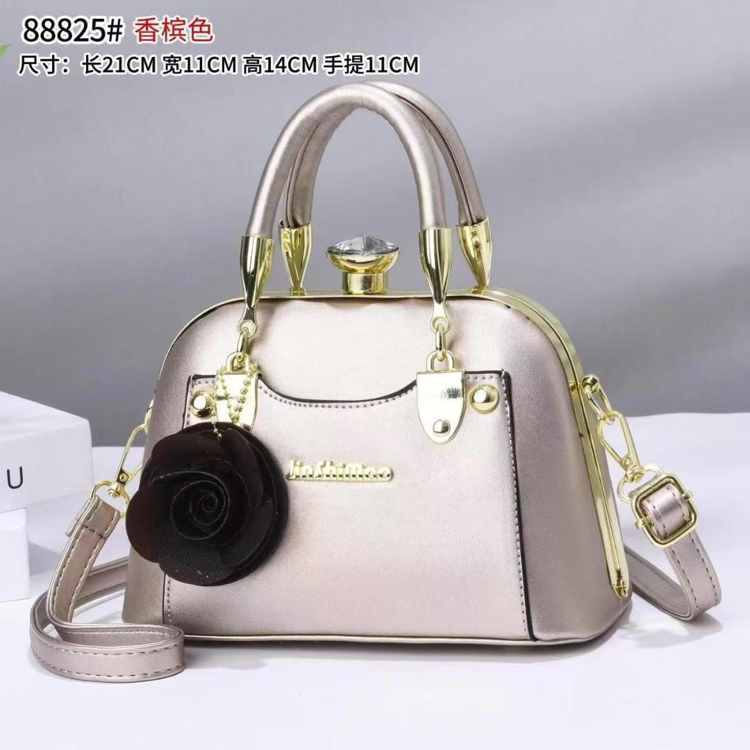 javcys stylish structured handbag featuring a classic dome-shaped silhouette with a smooth metallic finish, giving it a sophisticated and luxurious look
