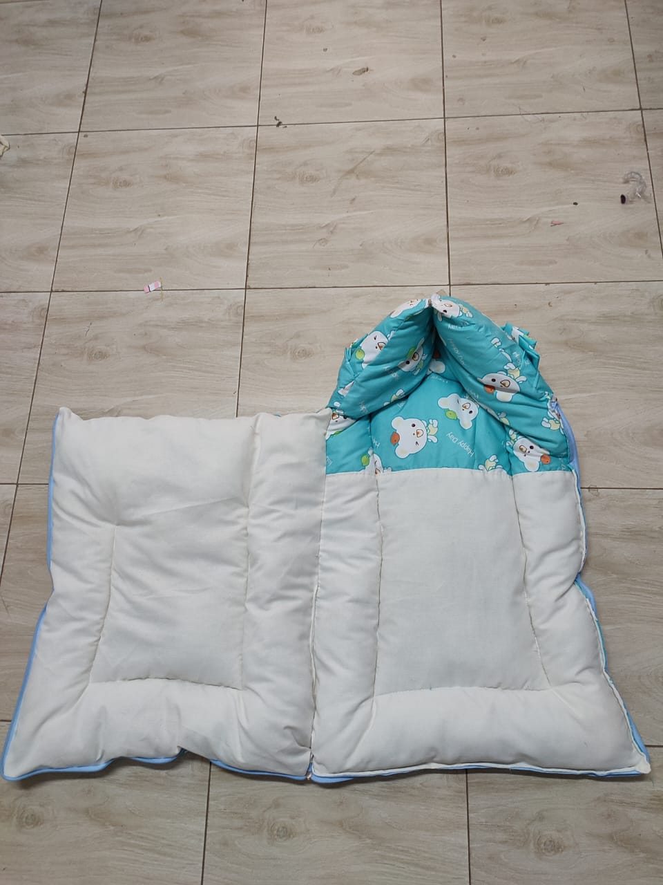 3-in-1 multifunctional baby sleeping bag, carry nest, and portable bedding mattress.Typically constructed from a breathable cotton blend with a plush microfiber or polyester cushioned filliing