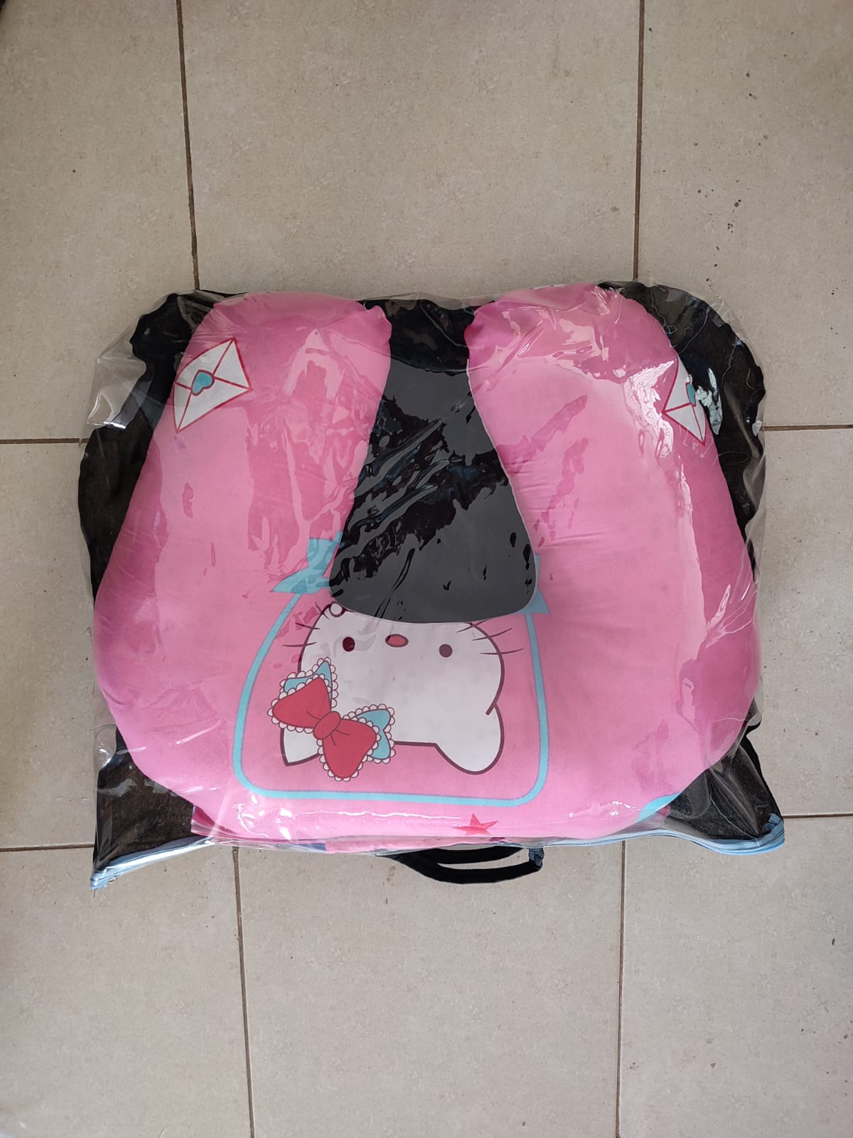 multi-functional baby nursing and feeding pillow set, tightly packed inside a clear plastic protective travel bag with a black zipper trim and handles.Ergonomic Baby Nursing Pillow  Lounger with cover