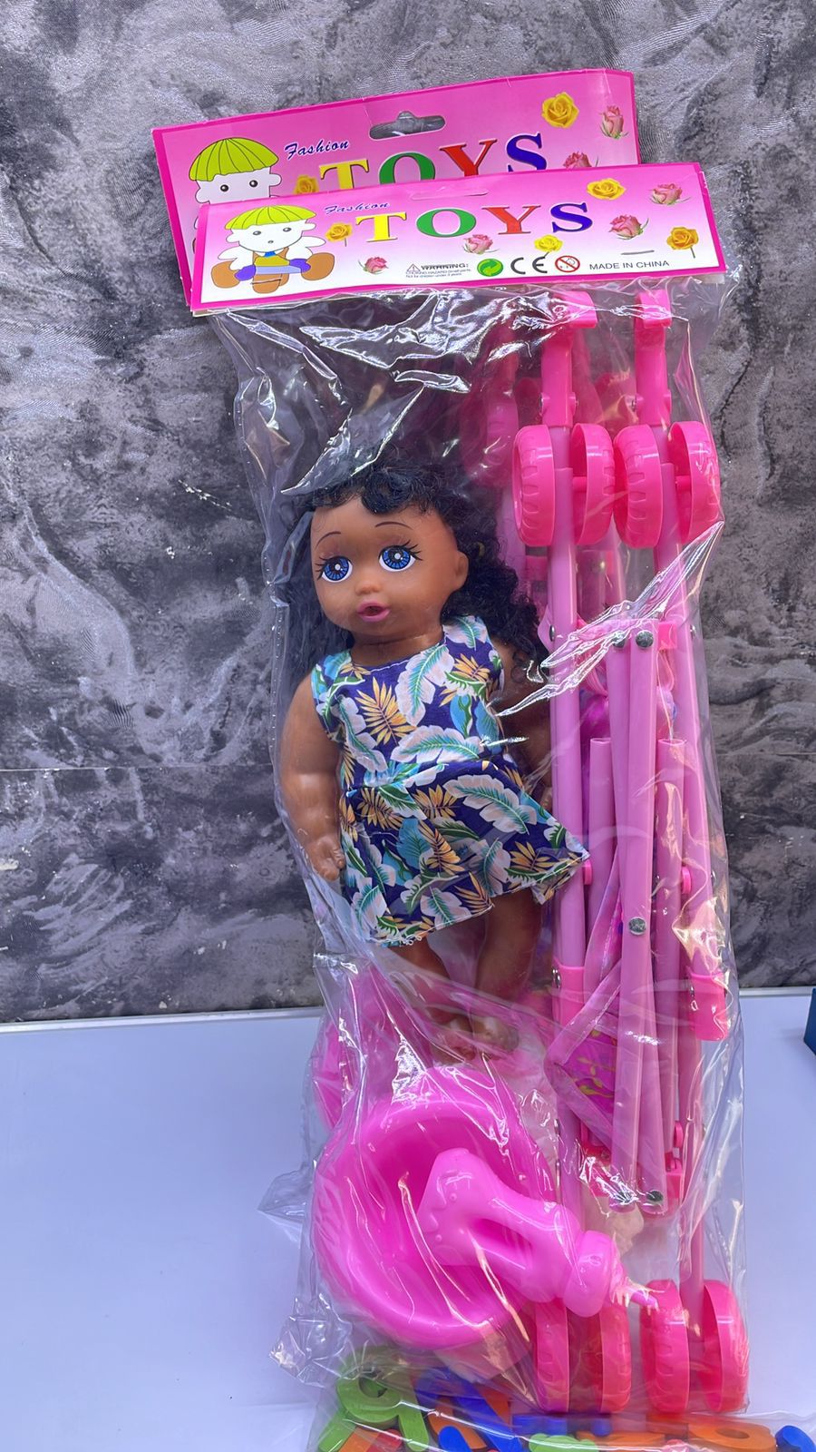 Doll Plus a Stroller 🔥🔥🔥28cm doll, 45cm stroller. Come with toilet training potty, diaper and feeding bottle. The doll is able to drink water and makes crying sounds