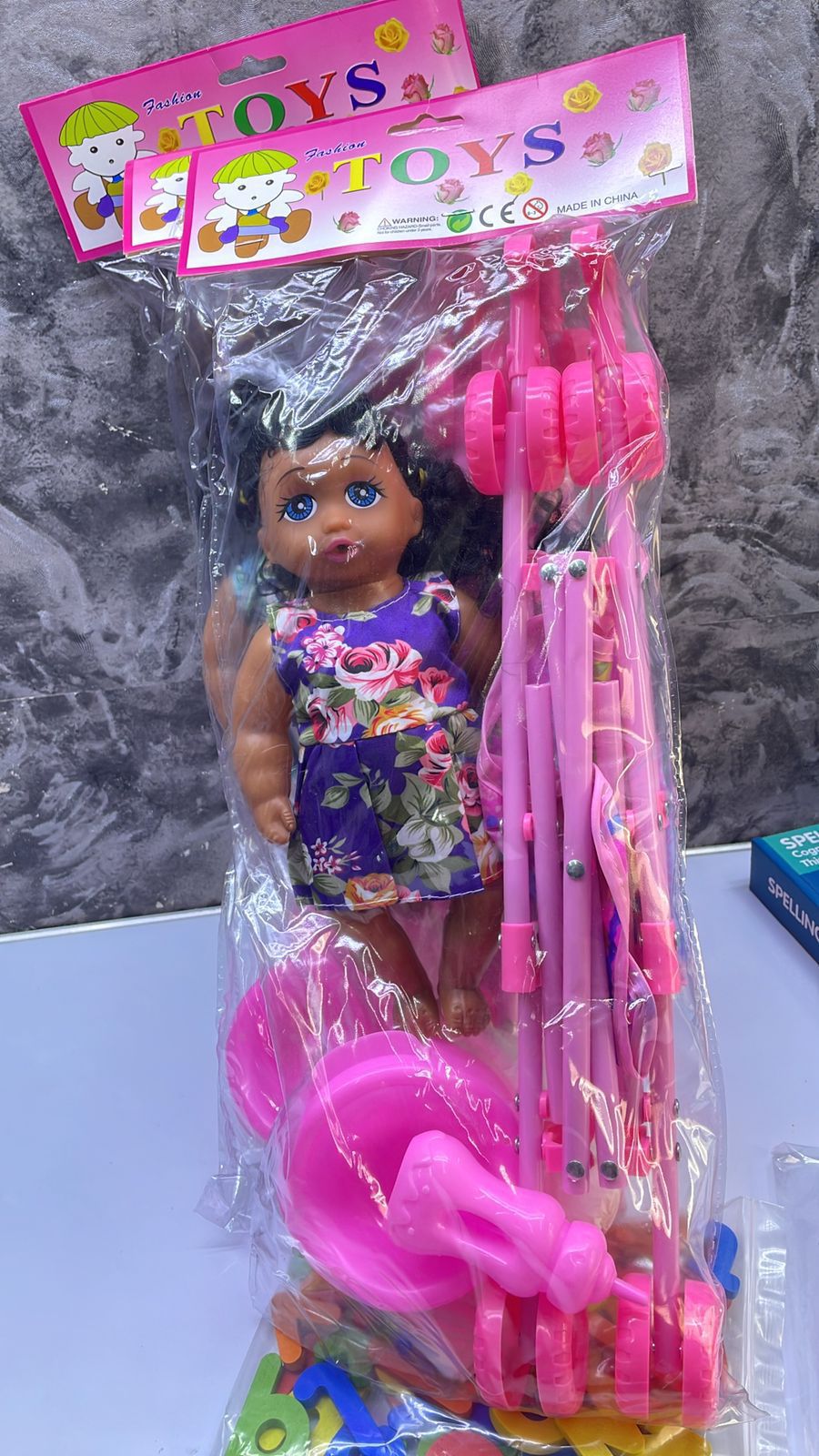 Doll Plus a Stroller 🔥🔥🔥28cm doll, 45cm stroller. Come with toilet training potty, diaper and feeding bottle. The doll is able to drink water and makes crying sounds