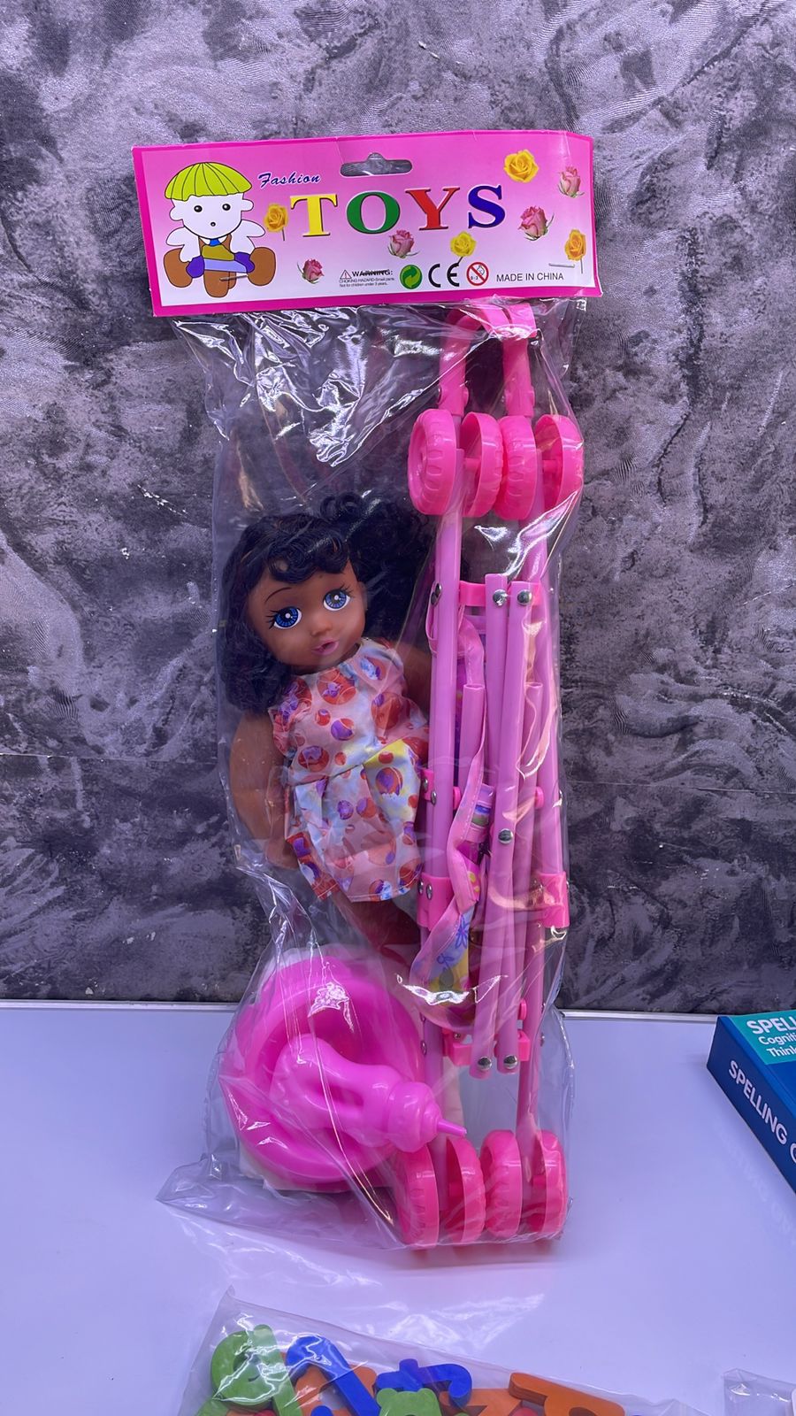 Doll Plus a Stroller 🔥🔥🔥28cm doll, 45cm stroller. Come with toilet training potty, diaper and feeding bottle. The doll is able to drink water and makes crying sounds
