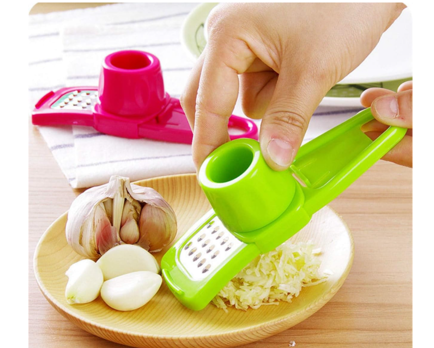 2-in-1 manual ginger and garlic press crusher grinder used for garlic, ginger, and vegetables . It is a compact, handheld kitchen gadget designed to quickly mince, grate, or slice small ingredients