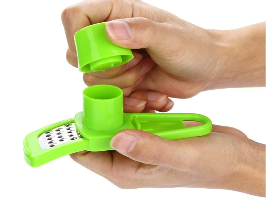 2-in-1 manual ginger and garlic press crusher grinder used for garlic, ginger, and vegetables . It is a compact, handheld kitchen gadget designed to quickly mince, grate, or slice small ingredients
