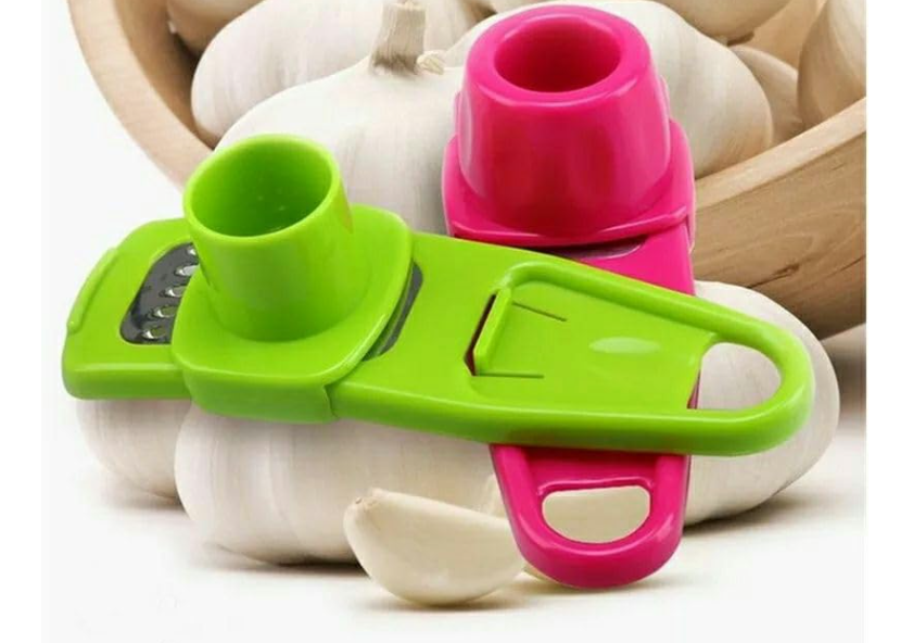 2-in-1 manual ginger and garlic press crusher grinder used for garlic, ginger, and vegetables . It is a compact, handheld kitchen gadget designed to quickly mince, grate, or slice small ingredients