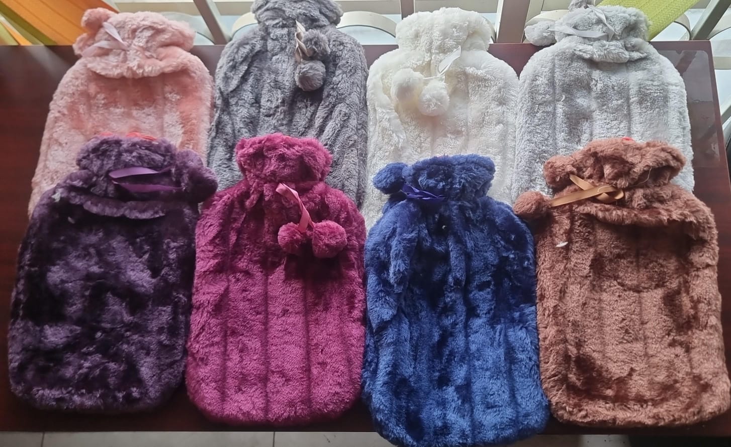 New arrival🔥🔥🔥 🎉🎉🎉🎉✔️Fluffy fabric covered 2 litre hot water bottle bag . provides soothing warmth and comfort during cold days or when relieving muscle aches, cramps, and stress. It features a