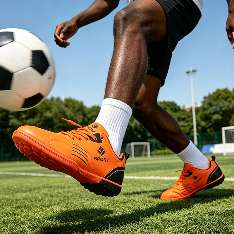 SXCHEN Men's Youth Soccer Cleat Shoes, Orange High-Performance Football Boots For Training & Matches, Lightweight Synthetic Material, Non-Slip Traction Sole, Lace-Up Design, Padded Footbed