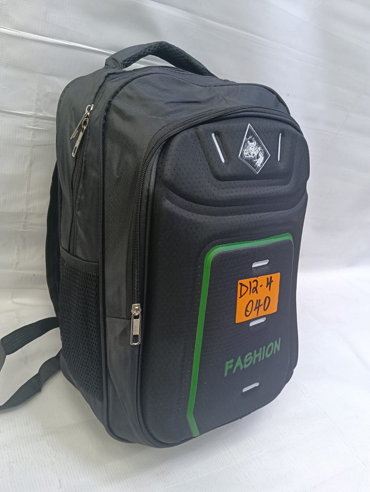 NEW ARRIVALS BEST PRICES Outstanding Unique Unisex multi-compartment everyday laptop and school backpack styled in matte black with vibrant green accents.