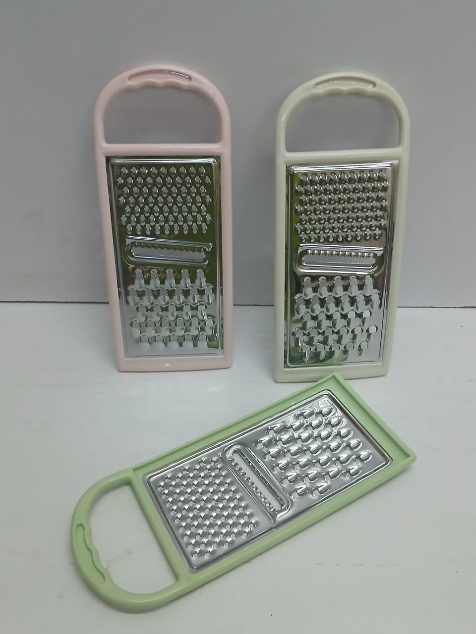 Multifunctional Stainless Steel Grater with Plastic Handle & Peeler – Vegetable, Cheese, Fruit & Kitchen Food Prep Tool