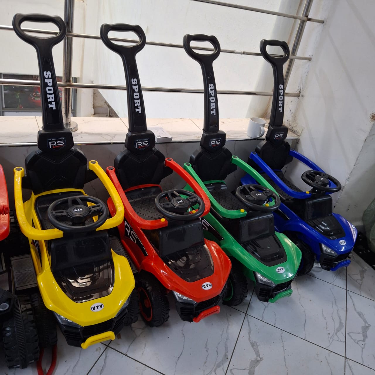 🛍️ DAILY OFFER 🛍️ - A 1 pc Push ride on car Has side protection bars, Removable push handle, and  Melodies and lights