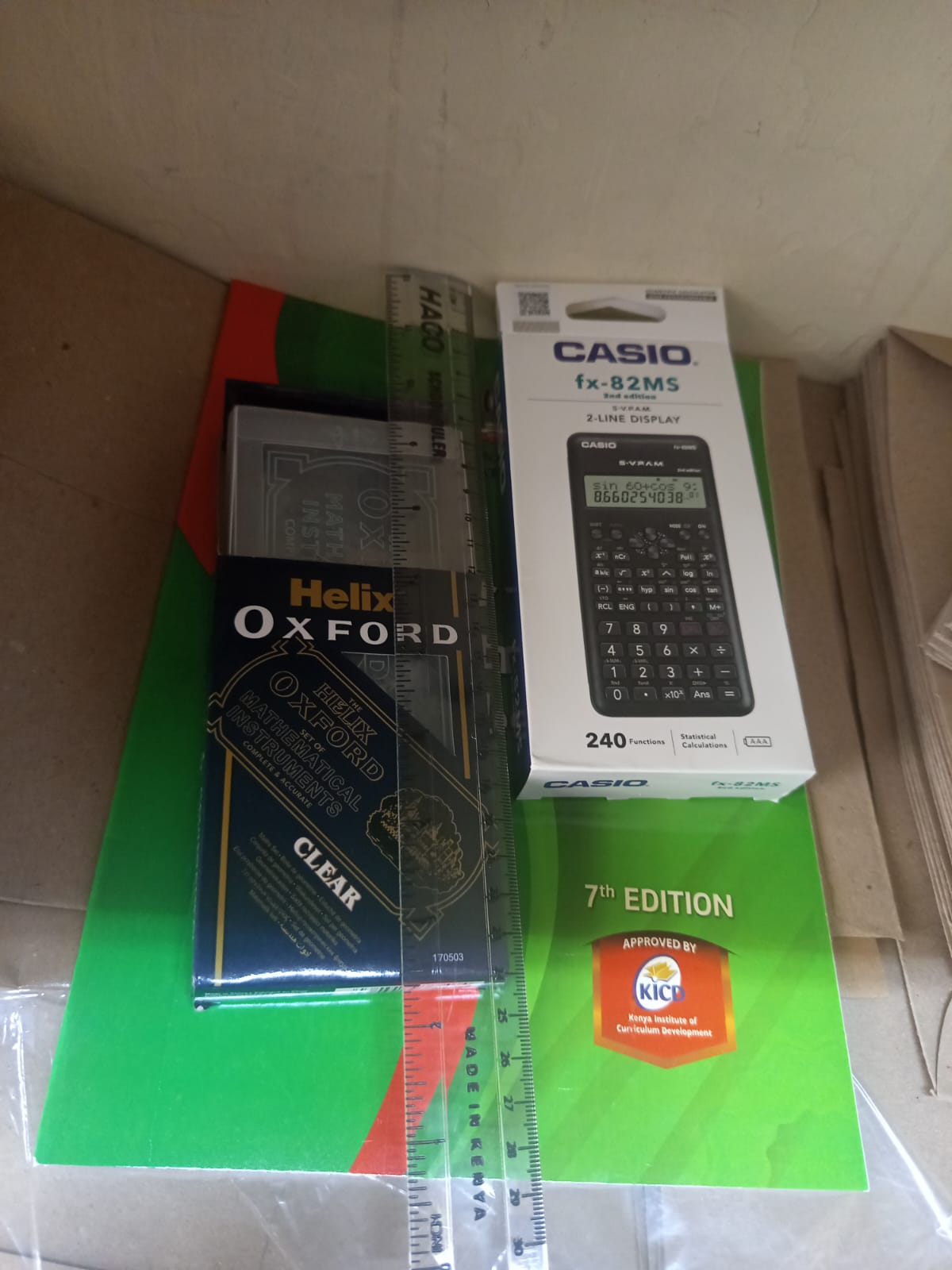 Calculator, Log Table & Mathematical Set – Complete Mathematics Kit -A practical mathematics study set containing a calculator, logarithm table, and mathematical instruments. Ideal for students.